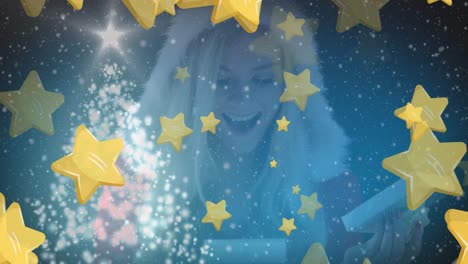 animation of stars over caucasian woman with gift