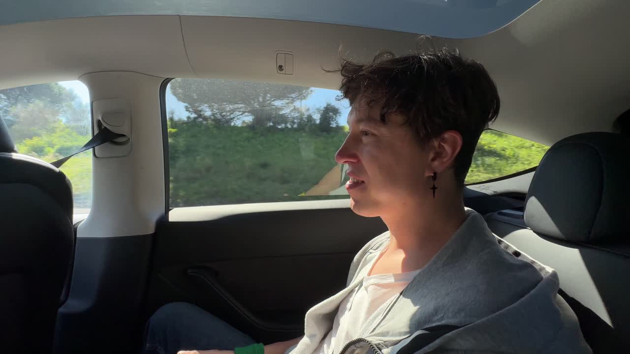 Person sitting in a Tesla Model 3