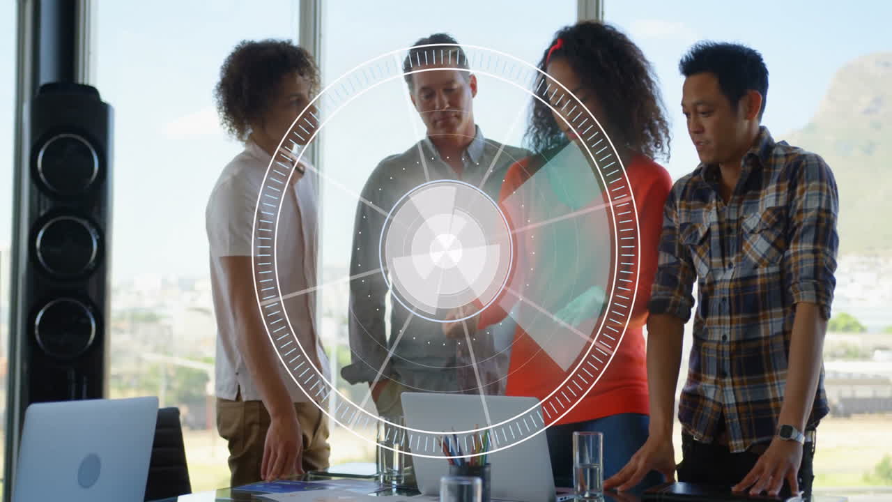 Diverse team collaborating at office with digital target animation overlay