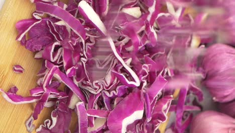 chopped red cabbage on a cutting board
