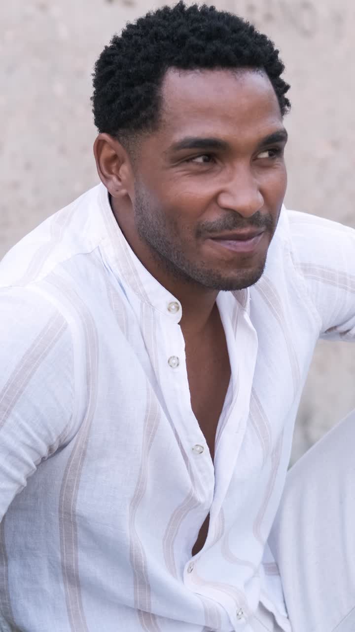 Diverse friends talking while sitting together at city park