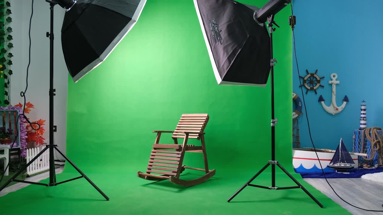 Photo or video studio with two hexagone studio lights. Green screen and fixed chair