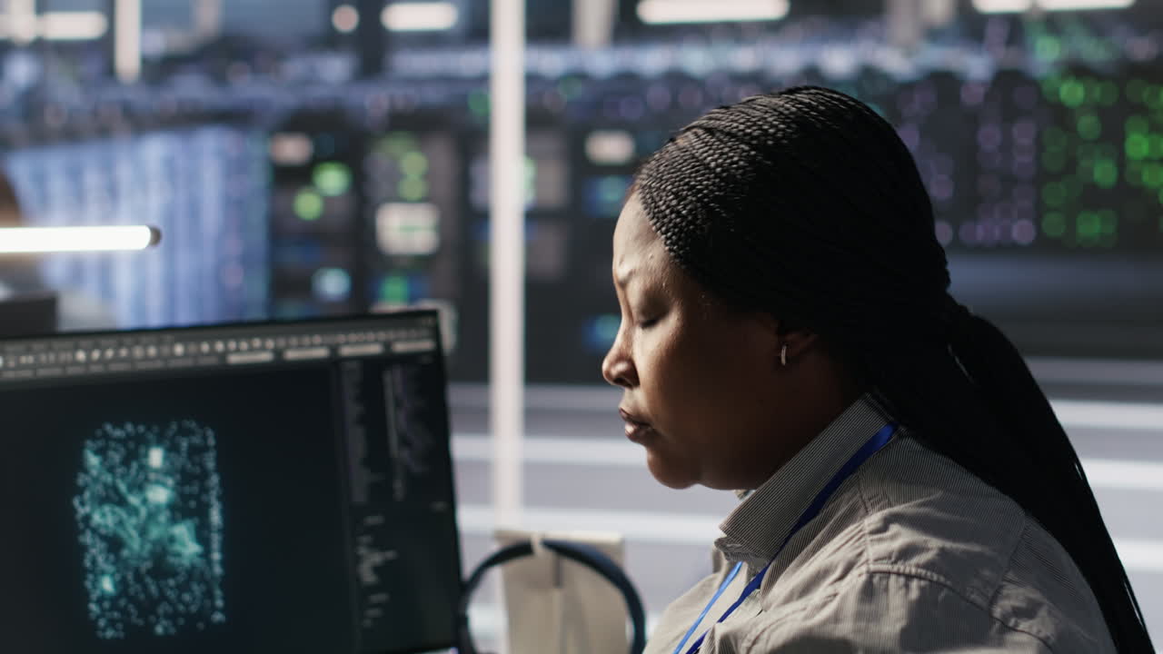 Vertical video Data center system administrator using PC to monitor neural networks