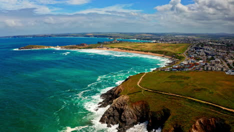 aerial drone shot over the picturesque rocky coastline in cornwall, united kingdom