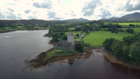 doe castle, towerhouse and stronghold, 15th century landmark of ireland on coast of sheephaven bay, drone aerial view