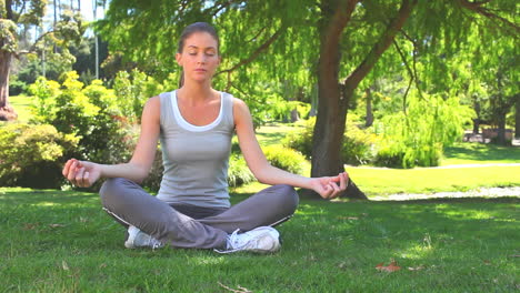 woman practicing yoga in the lotus position