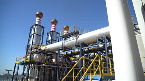 smoke-free chimneys against a blue sky