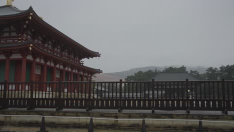 kofukuji temple in nara, pan over sacred grounds on rainy day in japan