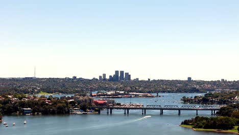 harbor vista: breathtaking view of a bustling cityscape beyond the calm blue waters