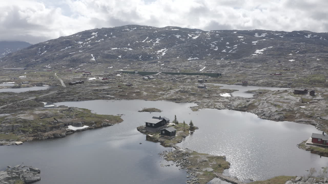 Aerial drone shot of the nordic rocky landscape of the town of Bjørnfjell at the Swedish border.
High view of the arctic tundra and vast wilderness.