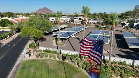 american and arizona state flags waving in golden hour sunlight