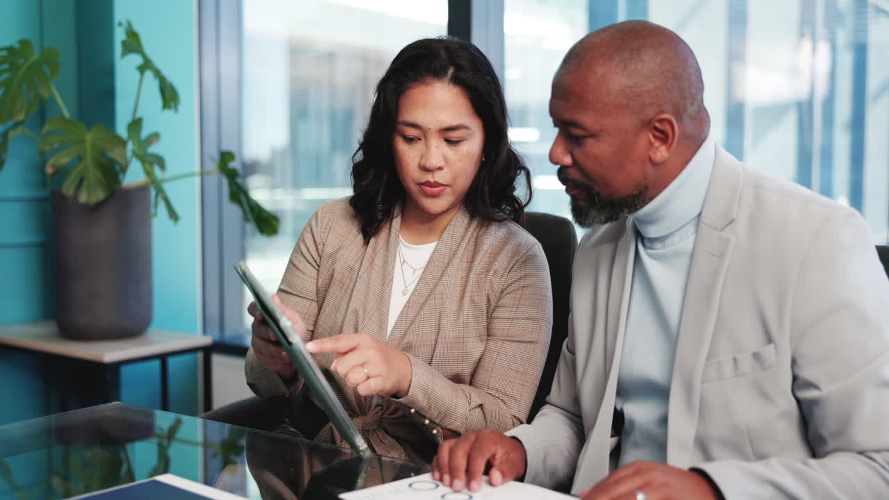 Diverse Business Professionals Discussing Strategy in a Modern Office Meeting
