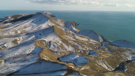 snowy mountain coastline aerial view