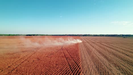 Aerial-of-Process-of-harvesting-using-Soybean-combine-harvester-in-rural-Georgia,-USA