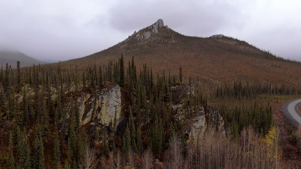 Scenic Ogilvie Mountains On A Cloudy Day In Yukon Territory, Canada - Drone Shot