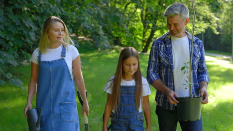family planting a tree