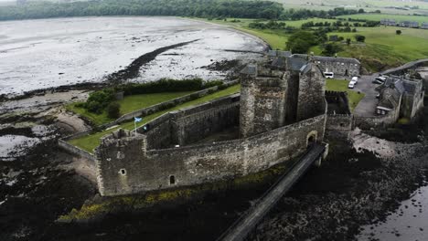 drone shot over the famous blackness castle on scotland's coast