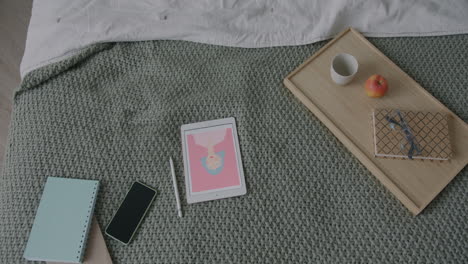 bedroom workspace with digital art tablet and accessories