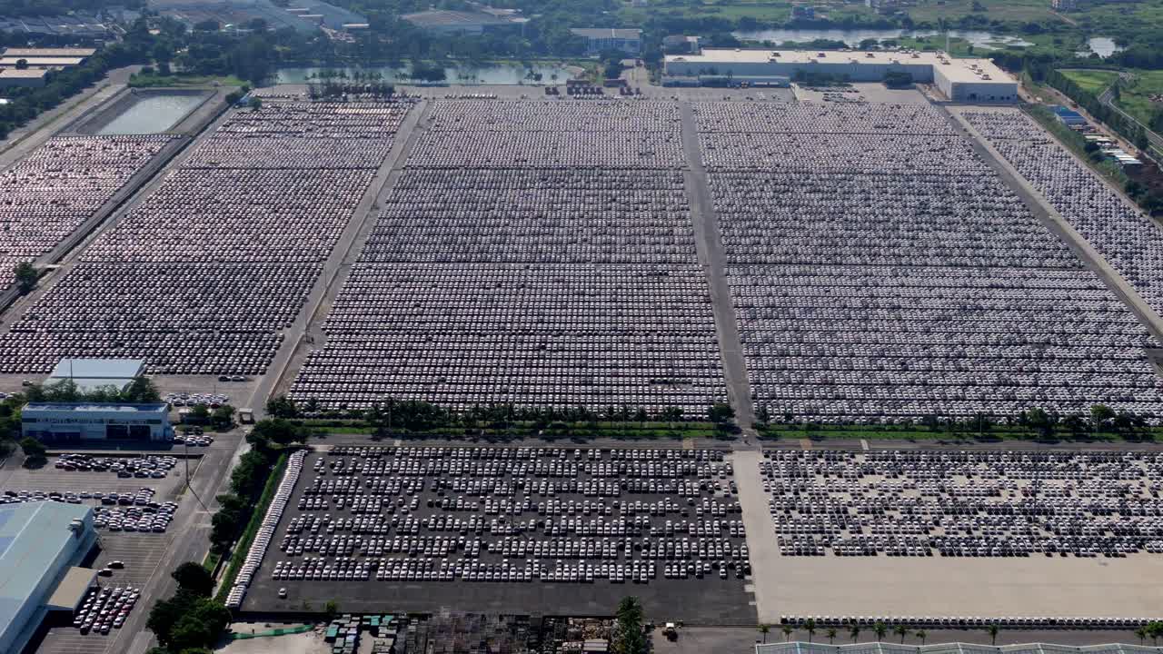 Massive inventory of unsold cars parked at an open warehouse beside Hyundai Motors India manufacturing plant in Chennai, Aerial