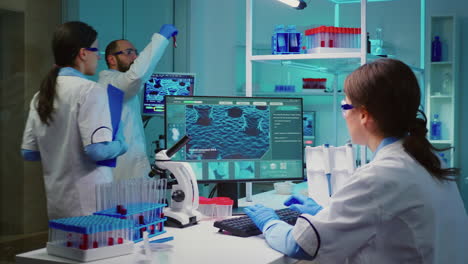 woman biochemist checking manifestations of virus