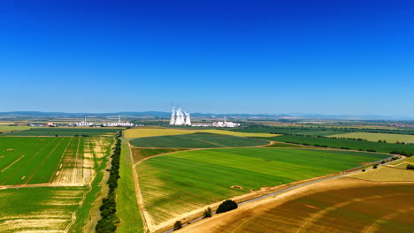 approaching the territory of an industrial factory located in the fields. plant away from the city.