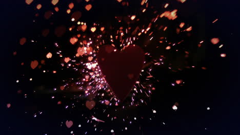 animación de corazones rojos y brillo cayendo sobre un fondo negro