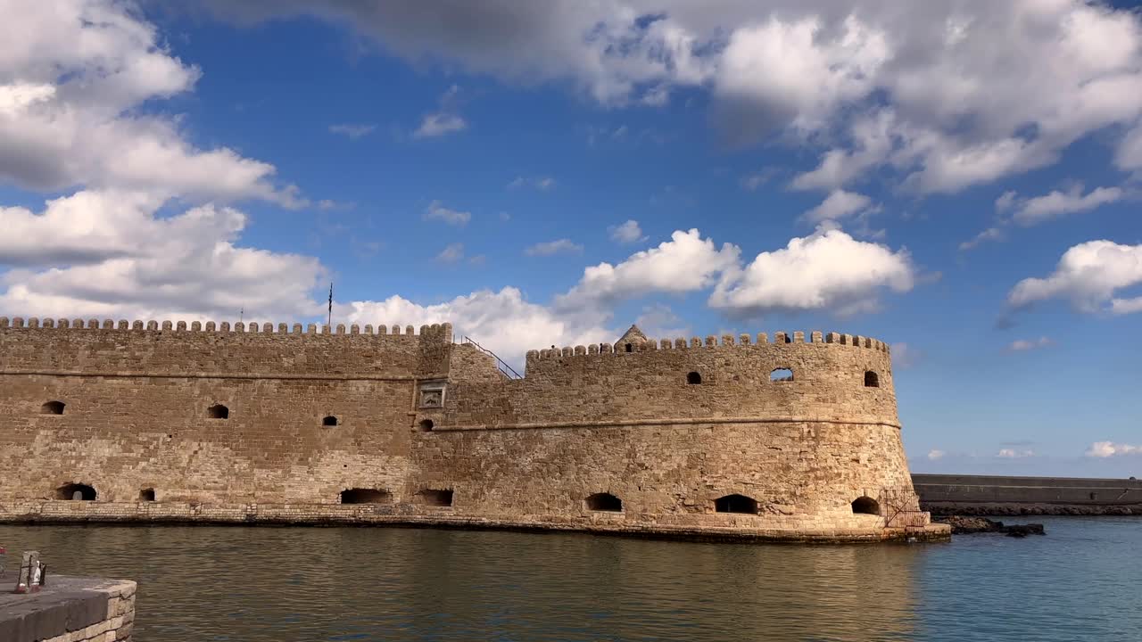 Medieval fortress by the water in Heraklion, Crete, Greece under cloudy sky