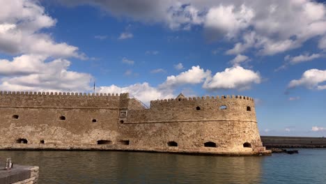 medieval fortress by the water in heraklion, crete, greece under cloudy sky