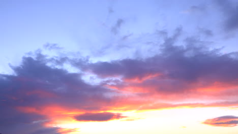 dawn between black storm clouds in fast motion