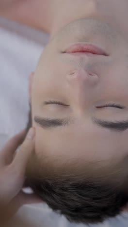 man receiving a relaxing head massage