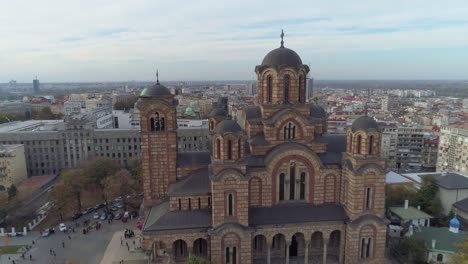 An-HD-aerial-shot-showing-downtown,-national-parliament,-St-Marco-church-and-a-park-in-Belgrade-on-a-nice-sunny-day