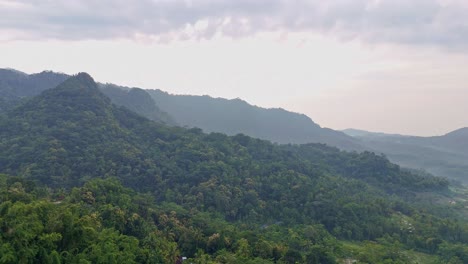 aerial nature scenery of mountainous rainforest in the slightly foggy morning. mountain landscape.