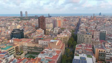 barcelona skyline during golden hour, capturing the city's dense architecture, aerial view