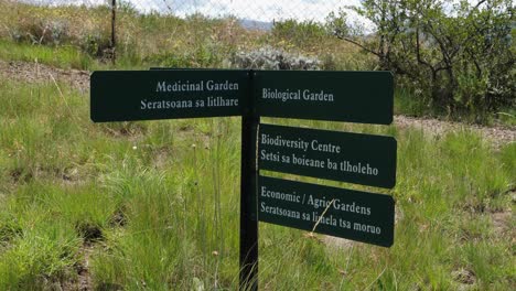 Garden-sign-post-in-English-and-Sesotho-languages,-Lesotho-Africa