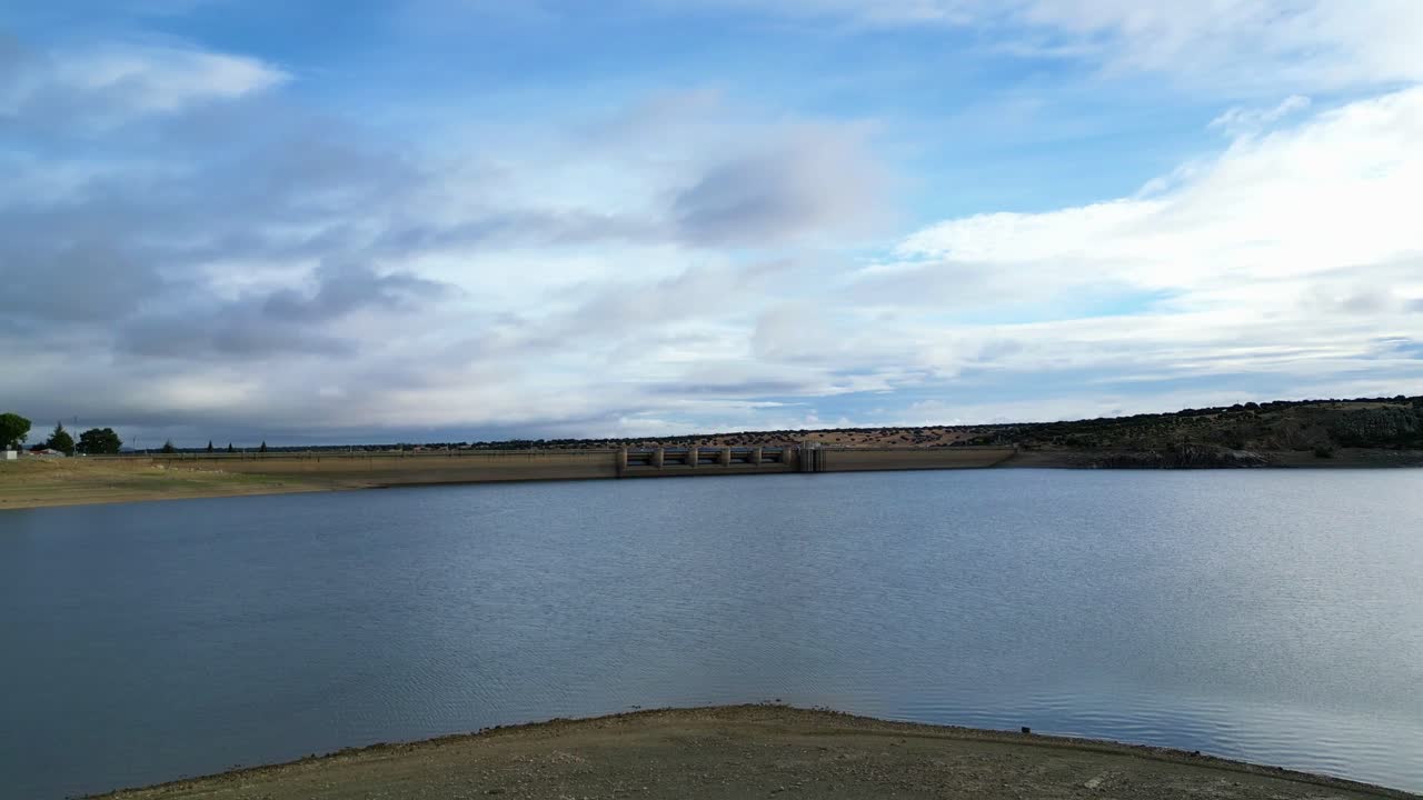 360 degree view around Spanish calm Spanish reservoir with beautiful sky and clouds.