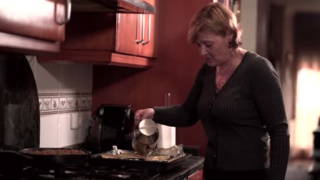 elderly woman cooking in the kitchen