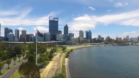 Beautiful-drone-shot-flying-towards-Perth-CBD-in-Western-Australia-on-a-gorgeous-summers-day,-blue-skies-with-few-clouds