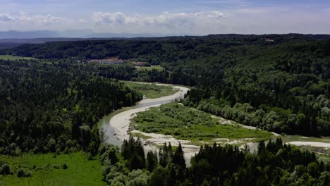 Curvy-Isar-river-in-southern-bavaria-besides-a-beautiful-summer-forest-landscape,-typical-for-the-beauty-of-the-relaxation-region-in-the-south-of-germany