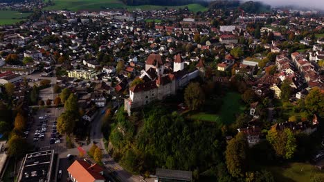 aerial view of a medieval castle in a picturesque swiss town