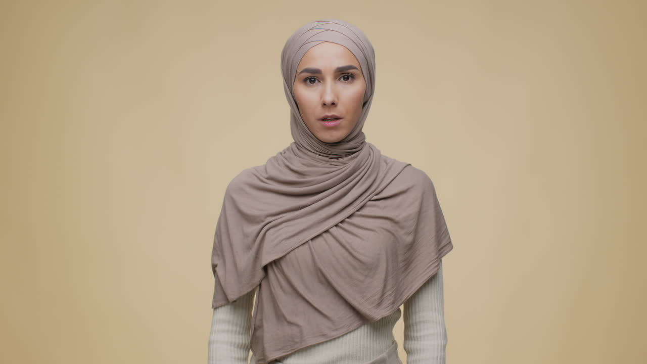 Woman in Hijab with a Serious Expression