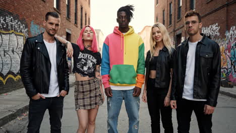 diverse group of young adults in urban alley with street style