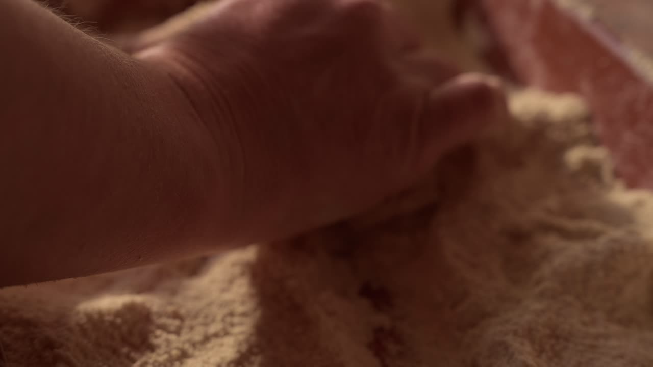 floured pig tripes being handled in rustic preparation from Minho Portugal