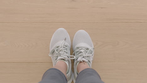 top view woman hands using smartphone taking photo of new shoes sharing photography on social media enjoying stylish fashion