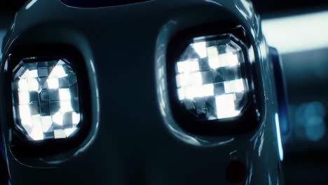 close-up examination of a futuristic robot's face with illuminated eyes showcasing advanced technology and engineering in a modern environment