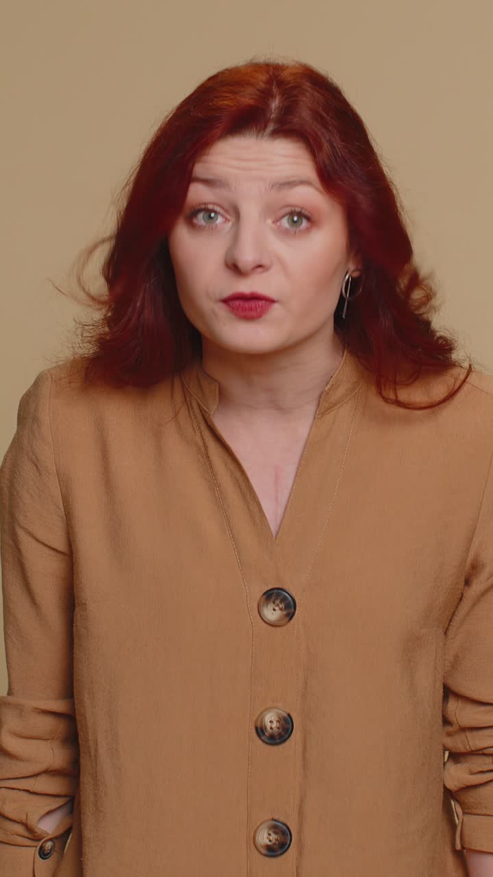 Displeased redhead woman blaming scolding for failure asking why this happened irritation quarrel