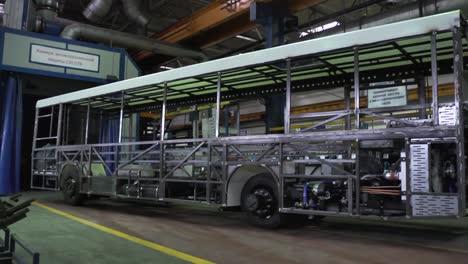 bus chassis under construction in a factory