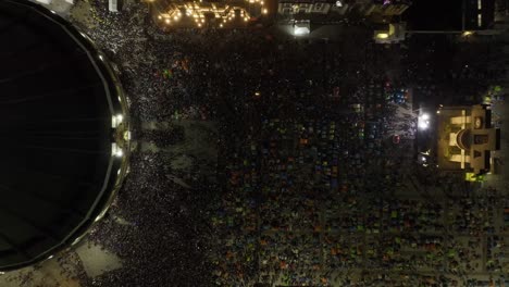 aerial view above people on the plaza mariana at the basílica de guadalupe, pilgrimage virgin day night in mexico - top down, drone shot