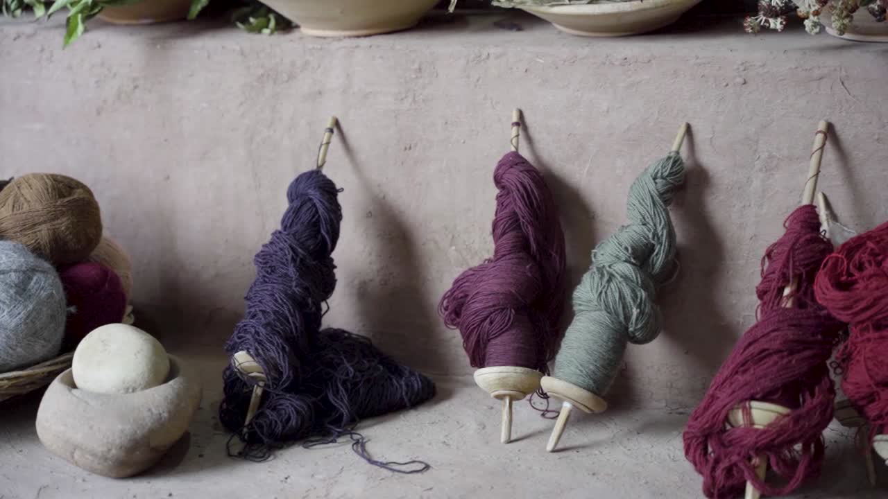 Detail of the natural hand dyed spools and balls of wool created by local artisans in Chinchero, Cuzco, Peru