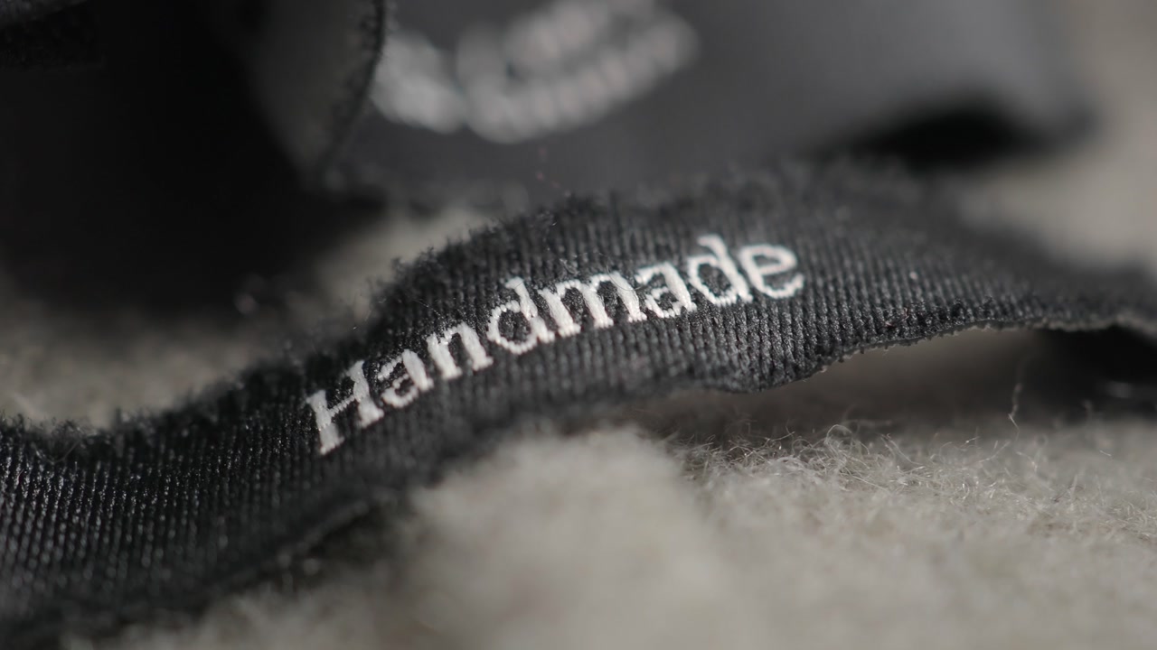 Macro Shot of a Black 'Handmade' Label on a Cozy Textile