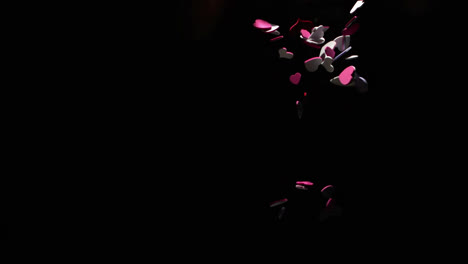 Animation-of-hearts-falling-over-black-background